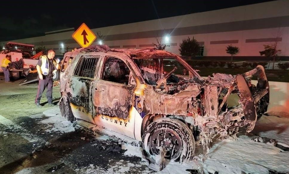 Repo Man rescues Deputy from burning patrol car